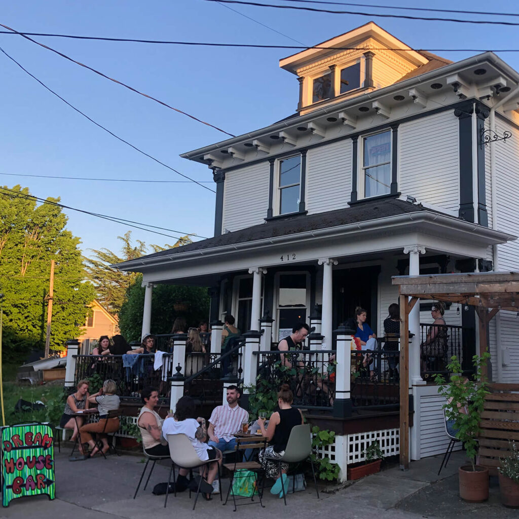 A crowd in front of the Dream House Bar.